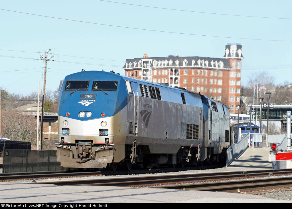 AMTK 199 leads train P092-26 away from the station